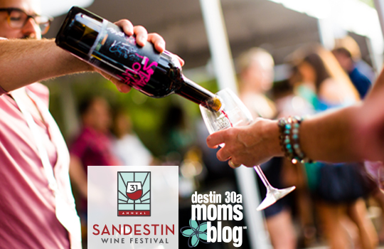 hand pouring wine sandestin wine festival