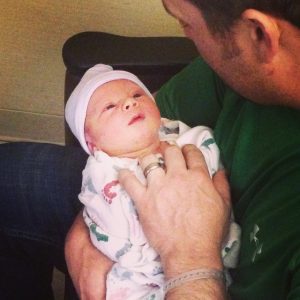 Father holding baby for the first time