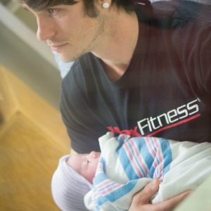 father holding newborn daughter